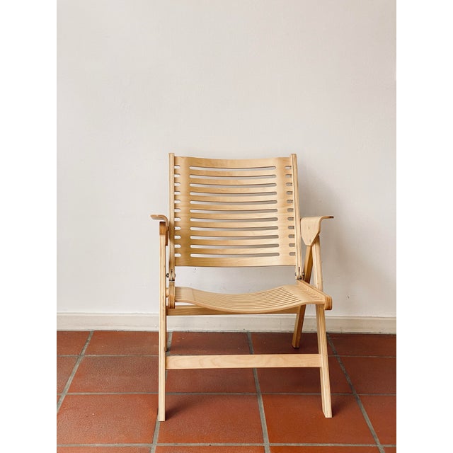 Iconic Rex Lounge Chair by Niko Kralj. The folding chair is an made of beech plywood and metal, designed in the late...