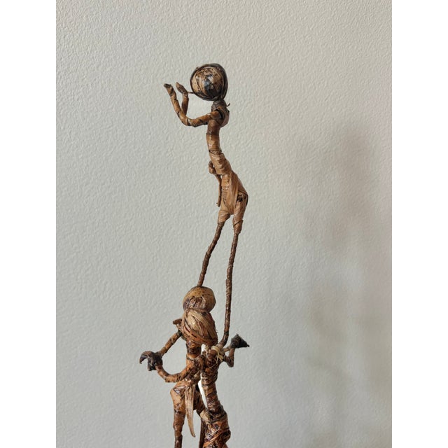 Balancing corn husk figures in a circus pile. Interesting folk art form to add to your decor. Most items found at Pub &...