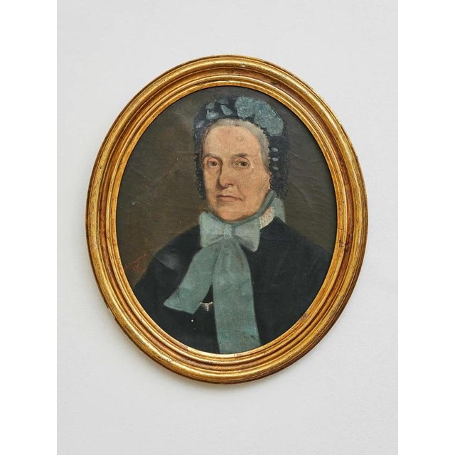 Oil on canvas, signed and dated 1875, gold oval frames A representative pair of portraits of a man and a woman from 1875,...