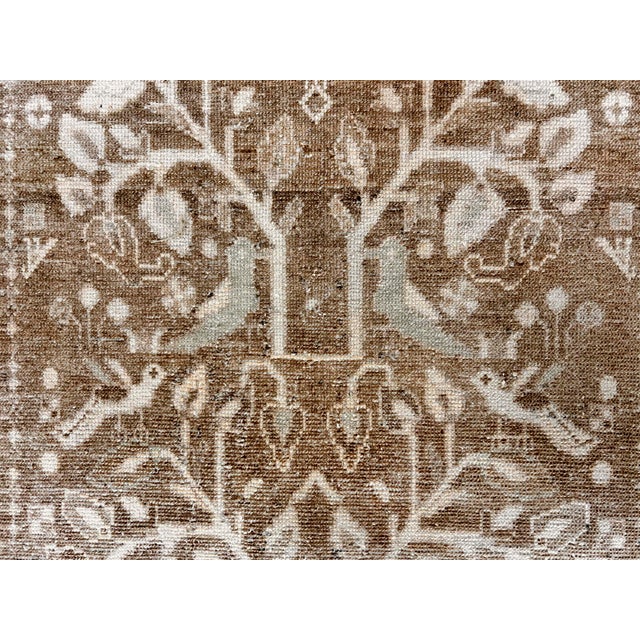 A very interesting design of birds flying around adds a lot of charm and character to this piece. Rugs from Malayer, east...