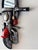 This unique wall mirror features a vintage style motorcycle design with red front fender and black handlebars. The mirror...