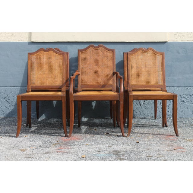 A beautiful set of 6 Carved Walnut Dining Chairs, 2 Arm/ 4 Side Chairs. Stunning flared leg and caned back and seat....