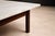 A sculptural Brazilian Modern coffee table by Ziglio Decorações, executed in solid rosewood with a refined marble top,...