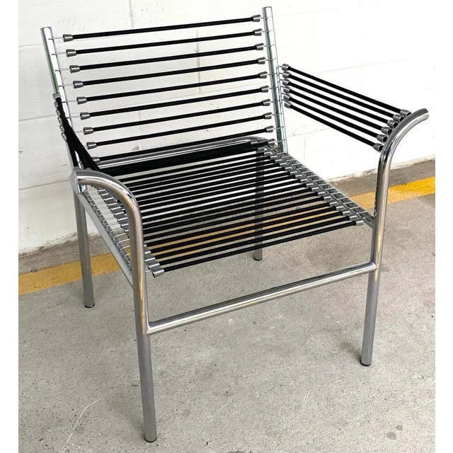 Modern bungee armchair after René Herbst a nice vintage 1990s version, measures: arm height is 25-inches, seat height is...