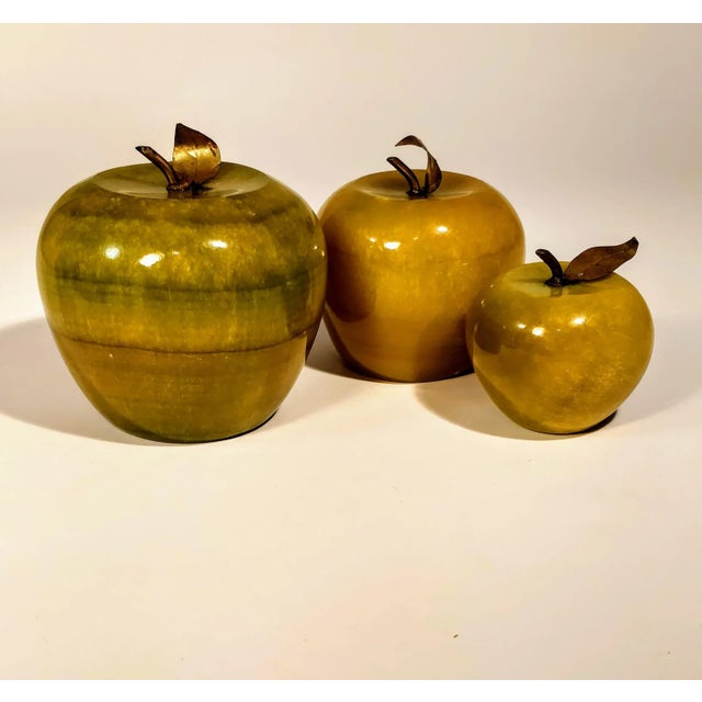 Vintage apple paperweights made of natural stone very mid century in look and feel. Set of three in large to small sizes....