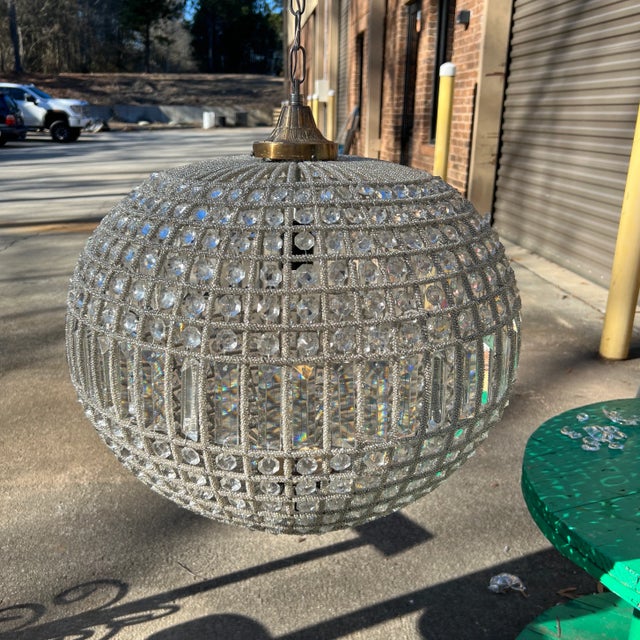 Gorgeous sphere chandelier. 14 inch chain and acanthus attached canopy