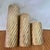 Add warmth and vintage character to your space with this striking set of three twisted brass candle holders. Each piece is...