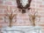 Two gold-plated wall sconces for candles, with an authentic and beautiful patina. Signs of wear are present.