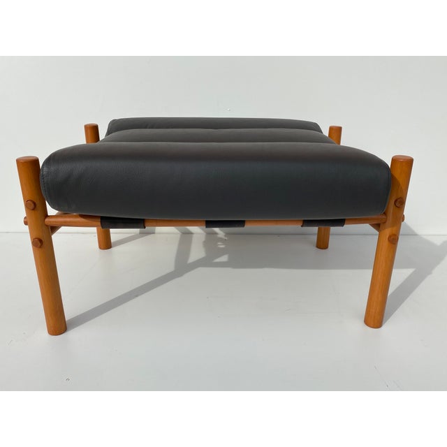Mid Century Modern style safari footrest / bench in dark charcoal leather