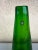 Handmade green glass art by Tarnowiec. Tall being 14” the base is 5.5” in diameter and the top is about 1”. There is a...