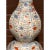 This impressive 23-inch Chinese Wucai porcelain double gourd vase features an octagonal faceted body decorated in vibrant...