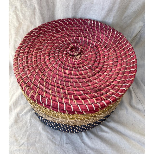Vintage Straw/Raffia Coiled Muti-Color Basket with Lid Red, yellow, natural, blue in color all coiled and woven together....