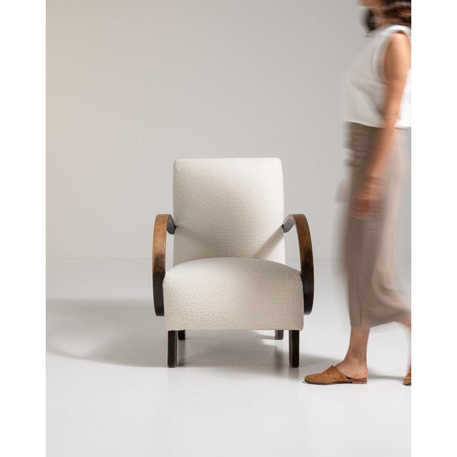 Bentwood-arm lounge chair in Warm Ivory Boucle. Its warm ivory boucle finish sets off curved wood open arms, plush ivory...