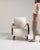 Bentwood-arm lounge chair in Warm Ivory Boucle. Its warm ivory boucle finish sets off curved wood open arms, plush ivory...