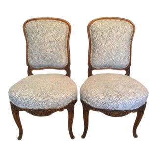 Antique Carved 19th Century French Walnut Side Chairs With Blue and White Animal Print- a Pair For Sale