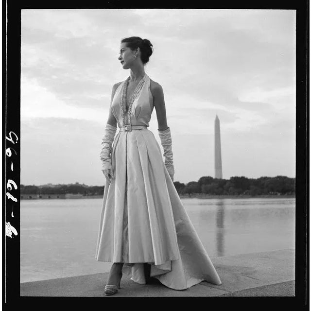 Washington Monument Fashion Shoot 1949 Fashion model posing in an evening gown with Tidal Basin and Washington Monument in...