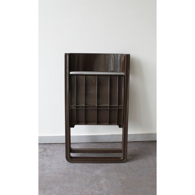 This Allibert folding chair from the 1970s, made of brown plastic, is a prime example of space age design. Matching desk...