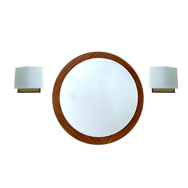 Pair vintage danish modern sconces, featuring a teak and brass support, black enameled back support, slightly rhombic...