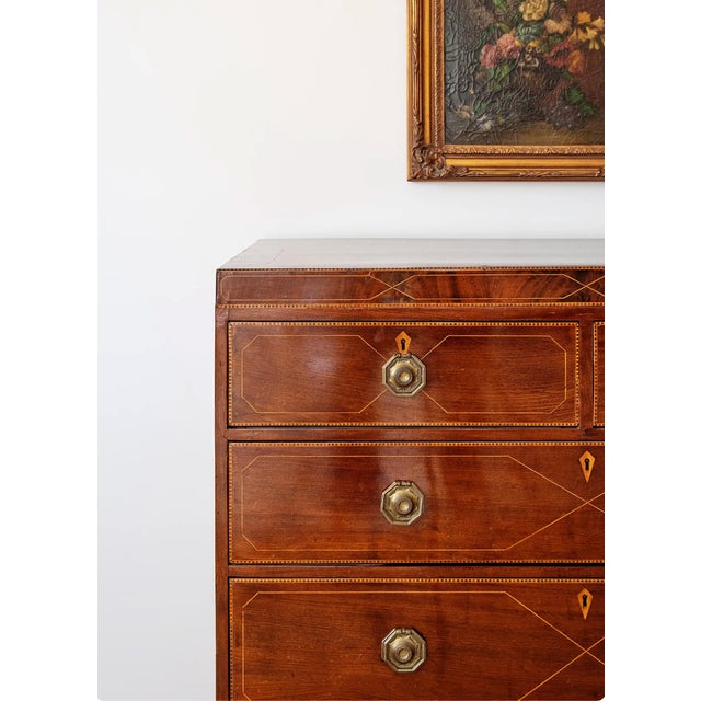 A remarkably elegant English Regency chest of drawers, crafted from richly figured mahogany and embellished with exquisite...