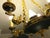 Bring classic elegance to your home with this beautiful 1970s Empire-style chandelier. It features a lovely dark green...