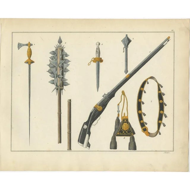 Title: 19th-century hand-coloured lithograph of medieval axes, maces, daggers, and firearm : this remarkable hand-coloured...