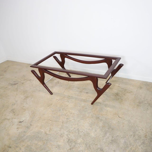 We offer this coffee table with the amazing and characteristic Attributed to Eugenio Escudero, made in México in mahogany...