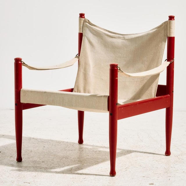‘Model 30’ safari lounge chair and ottoman from the 1960s, designed by Erik Wørts for Niels Eilersen. The canvas-covered...