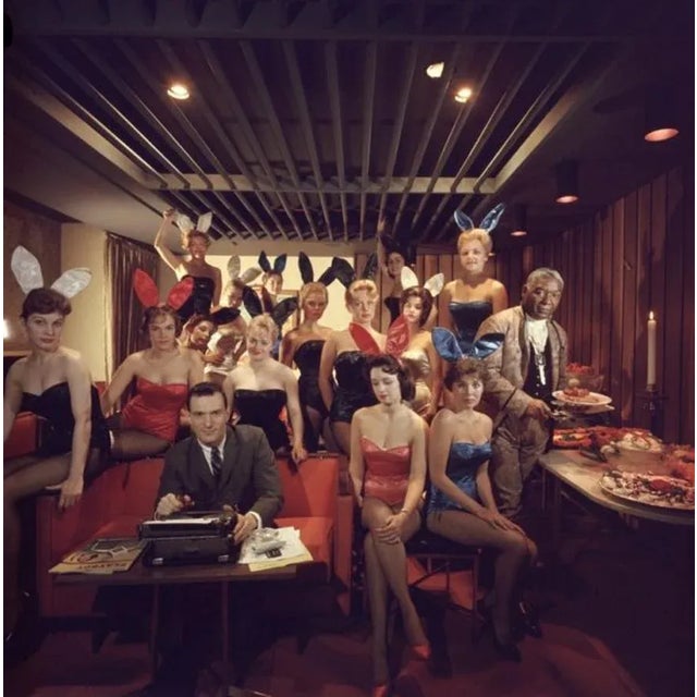 Man’s Work 1960 by Slim Aarons Slim Aarons Limited Estate Edition Working at his typewriter surrounded by ‘bunny girls’,...