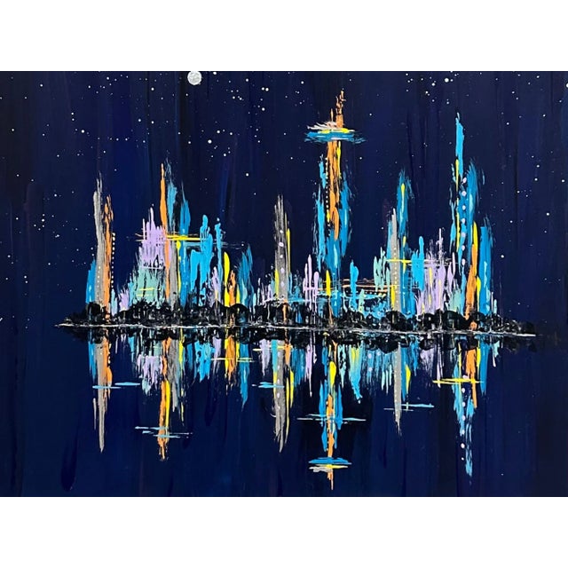 This colorful cityscape painting is 10" x 10" and is titled "Night in the City." It depicts a beautiful urban cityscape...