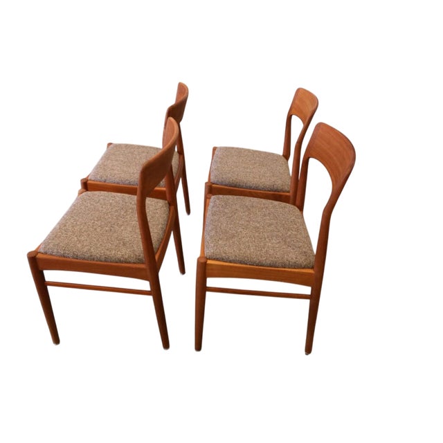An elegant set of four chairs in golden brown teak, designed by Henning Kjærnulf for KS Møbler in Denmark. with its soft...