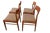 An elegant set of four chairs in golden brown teak, designed by Henning Kjærnulf for KS Møbler in Denmark. with its soft...