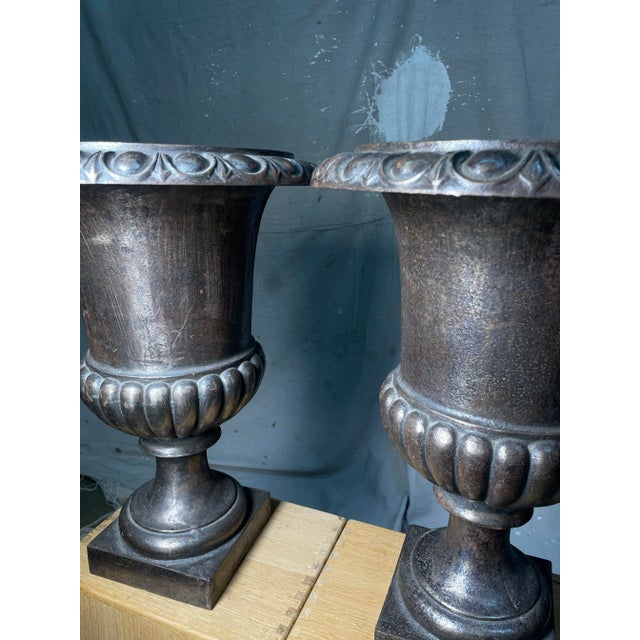 A stunning Neoclassical Wrought Iron Jardiniere or Urn with a pedestal base; their sturdy construction gives them...
