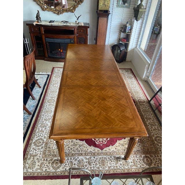 The Grenadine Rectangular Dining Table from Tommy Bahama creates a stunning centerpiece for any dining room. Paired with...