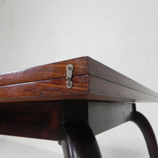 This is a handy table: Turn the top and open it and your table is suddenly twice as big. There is storage space under the...