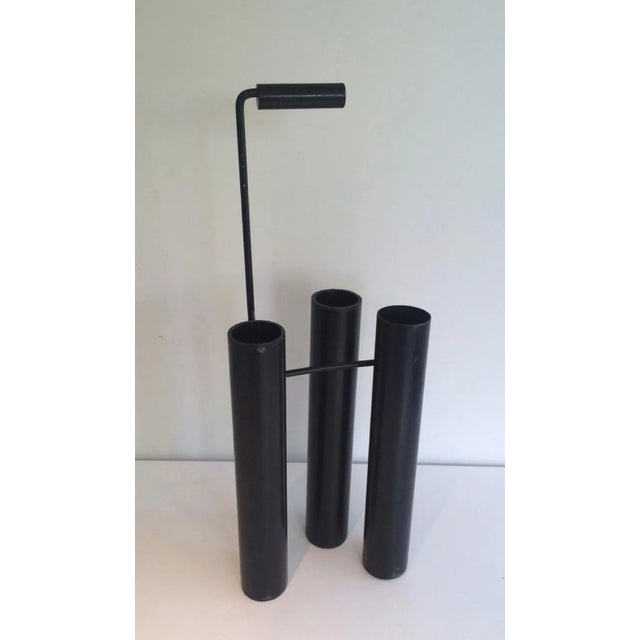 This very nice design umbrella stand is made of black lacquered Metal. This is a French work, circa 1970.