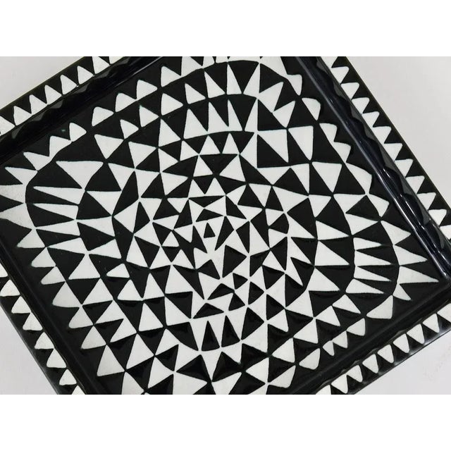 A beautiful black and white "Domino" tray / plate / bowl made of stoneware / ceramic from the 1950s, designed by Stig...