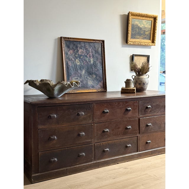 A remarkable late 19th-century French oak shop counter, discovered in a centuries-old mercantile in the French...