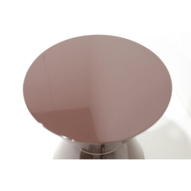 Minotti's Cesar's table in plum shiny lacquer. Goes anywhere and perfect wherever you need a side table with style,...