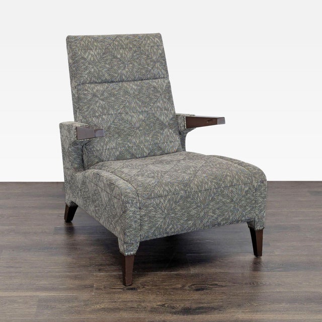 This lounge chair from Ted Boerner Furniture features stylish patterned upholstery and sturdy wooden arms and legs. The...