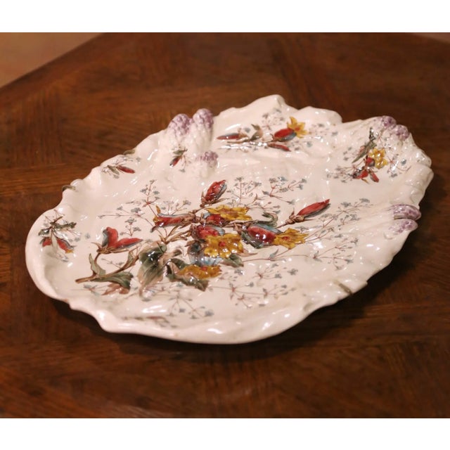 Decorate a dining room wall or display shelf with this elegant antique barbotine platter. Crafted in France by Keller &...
