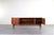This teak sideboard model Premium by Bartels is the essence of mid-century modern style and solid German craftsmanship...