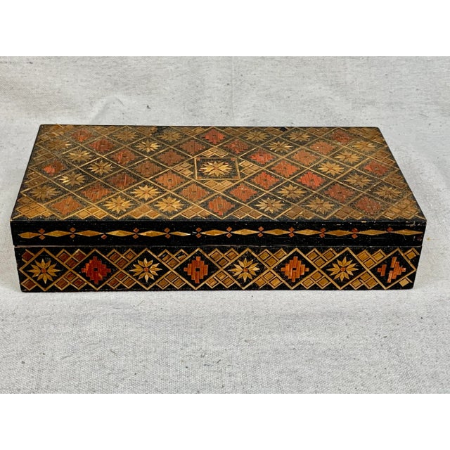 Beautiful vintage wooden box. Features a geometric design made of straw. I believe it is Russian. Inside it’s lined and...