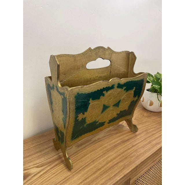 Makers mark on the bottom shows that this item was made in Italy. Painted gold Toned and green, material unknown. Possibly...