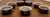 This authentic set of seven Tibetan Buddhist Yonchap — water offering bowls —each measuring 3.25 inches in diameter by...