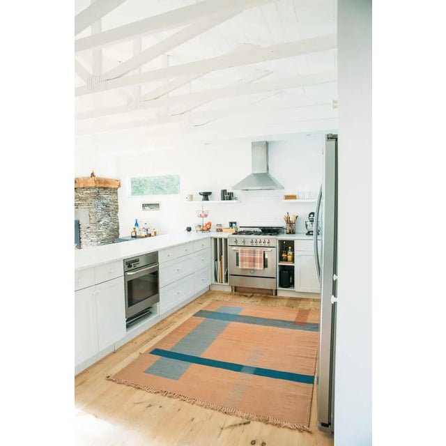 Made-To-Order Flatweave Moroccan kilim rug. Dusty Rose background with brick red, aqua, light blue and chambray color...