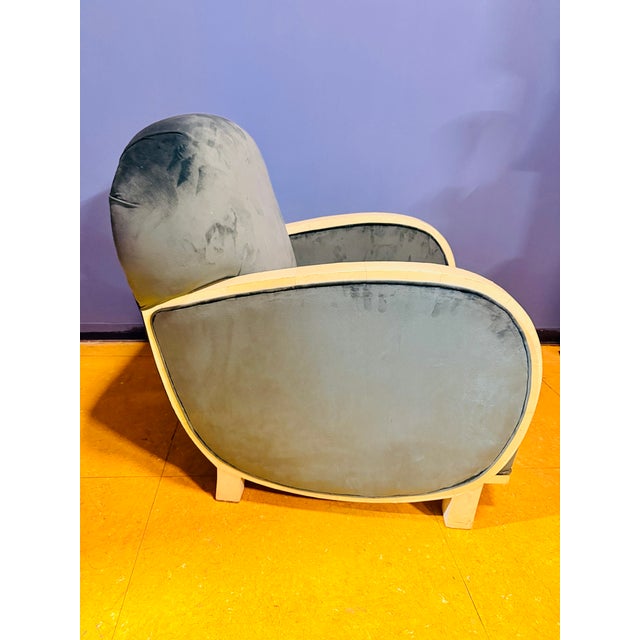 A splendid and rare pair of Art Deco club chairs, characterized by a monumental, sinuous line and extraordinary visual...