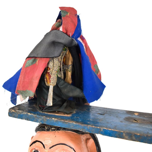 The Gelede mask, originating from the Yoruba people living along the southwestern Nigerian and Beninese border, showcases...