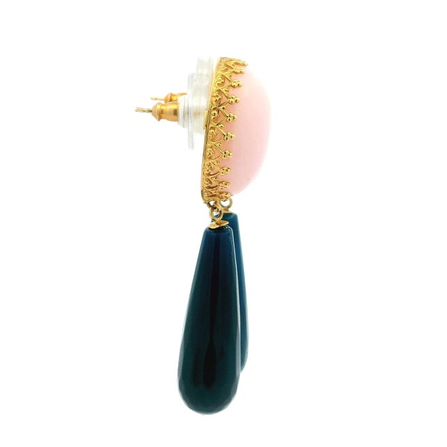 Designed and handcrafted in the USA by Talia Jade, these striking contemporary drop earrings pair vivid natural pink coral...