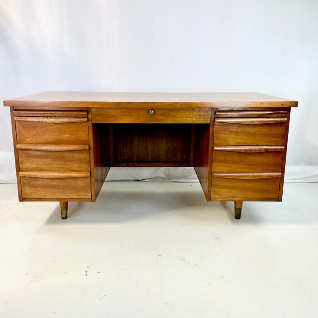 This is a stunning Executive Desk from the Mid-Century. We estimate1960-70s. The base and drawers of the desk are walnut....