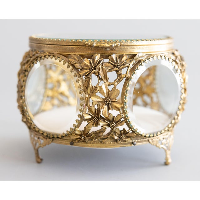 A gorgeous antique French gilt brass ormolu beveled glass footed jewelry casket or dresser box with hinged lid and lovely...